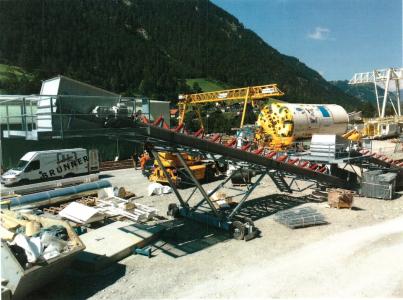 Stockpile and mobile conveyor with solid rubber tires